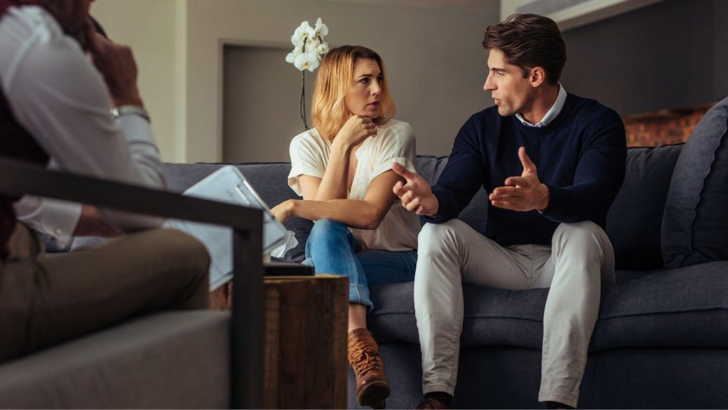 Why Family Matters in Intensive Outpatient Treatment 2 Couple talking with a therapist during a family session in intensive outpatient treatment.