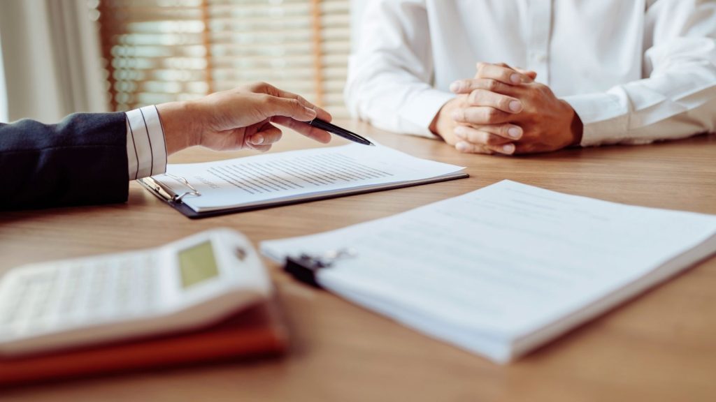 What to Look For When Choosing an IOP 2 Reviewing treatment options and paperwork when choosing an IOP.