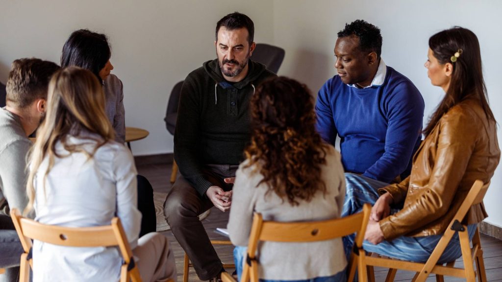 Group therapy session in a partial hospitalization program for substance use recovery