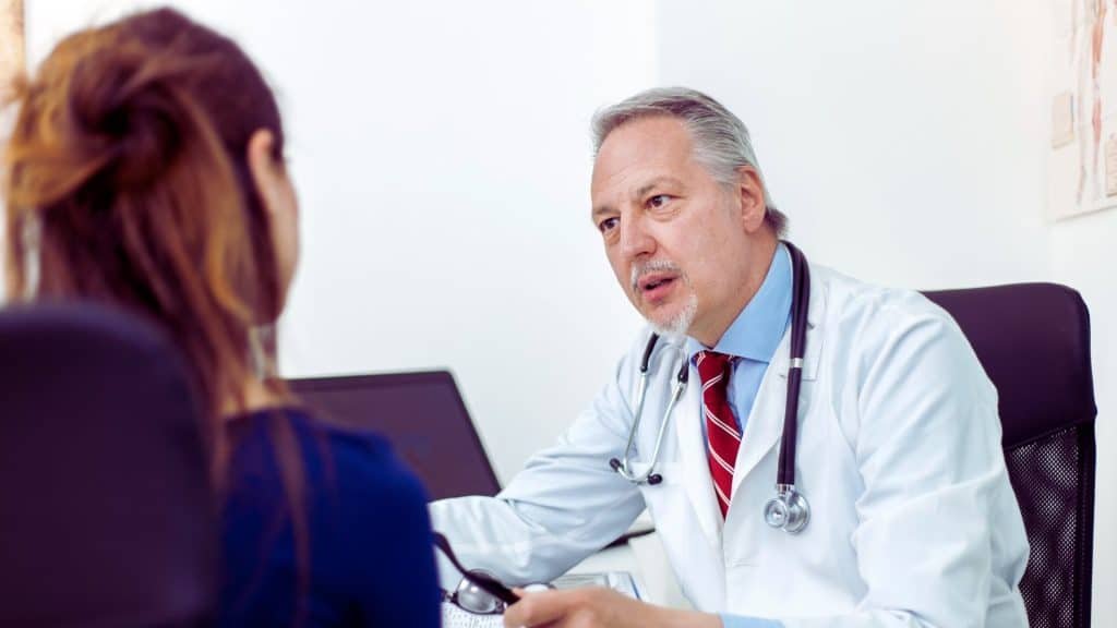 Doctor discussing treatment options for alcohol cravings with a patient