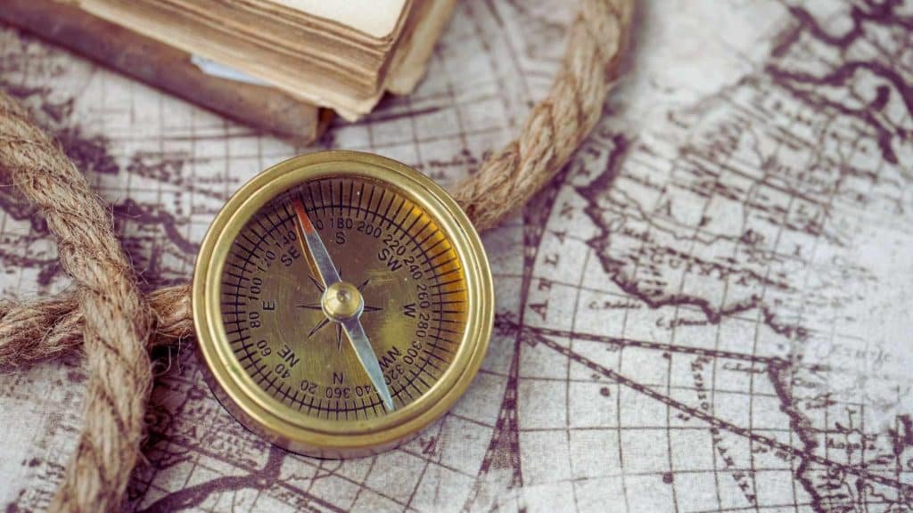 Compass on a map representing guidance and treatment paths for alcoholism