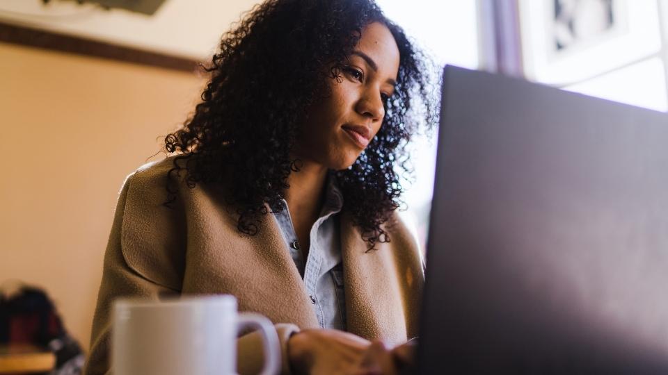 Functional Alcoholic image of a woman working despite her personal alcohol troubles.