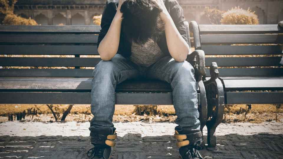 Depression and Alcohol Why Drinking Makes Depression Worse hero image of a man feeling depressed.