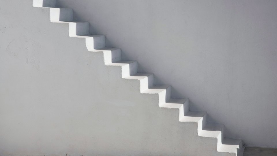 The 12 Principles of AA hero image of an empty staircase.