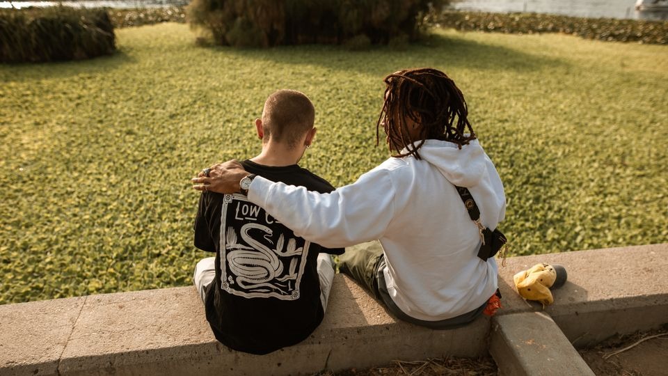 Two friends talking on a porch about drinking, a better indicator than an alcoholic nose